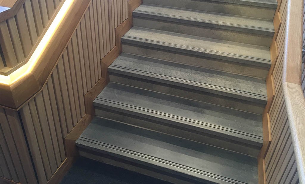 Precast concrete steps with twin carborundum grip strip inlays