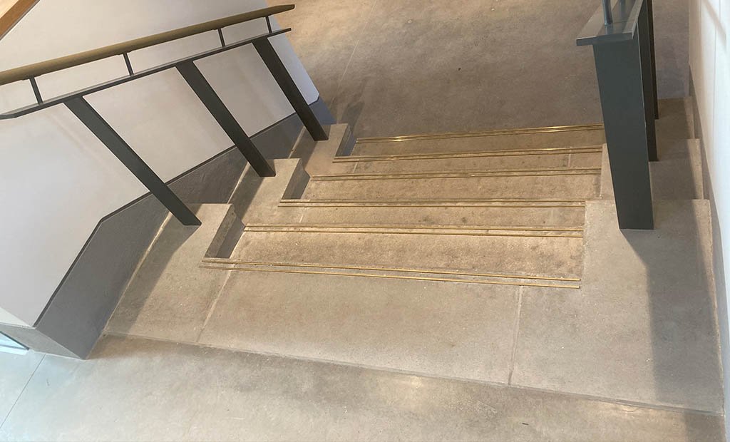 Pavillion precast staircase with brass grip strips